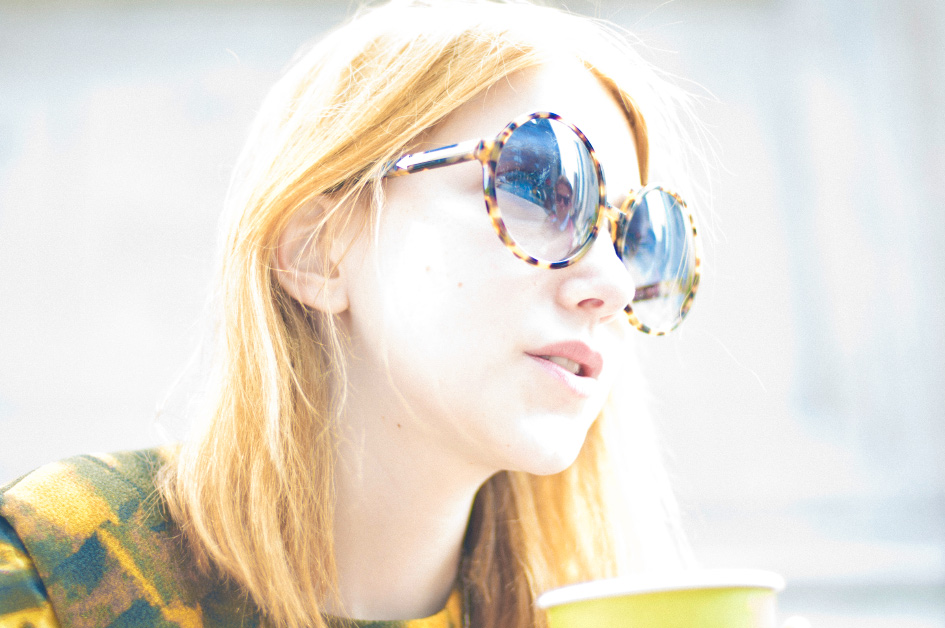 Julia Frakes Photo Portrait of Writer of Bunny Bisous, stylist, and red head Julia Frakes with yellow and black sunglasses picture by artist danny roberts
