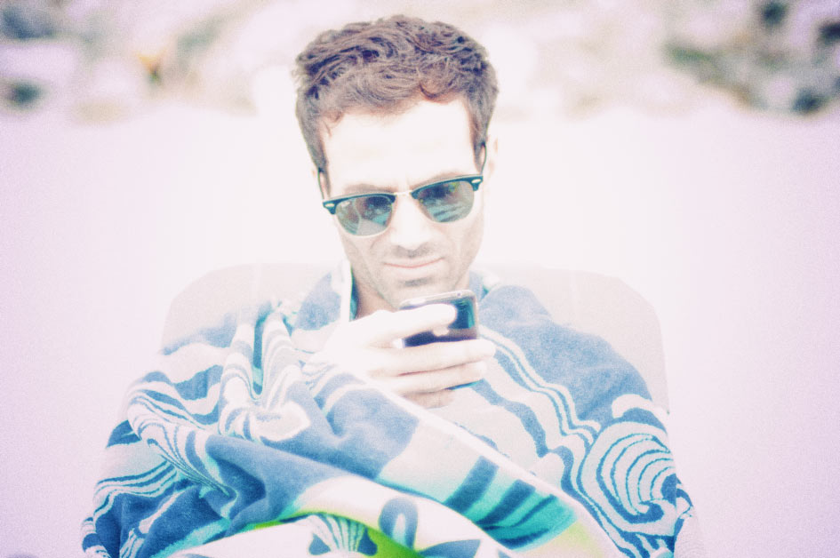Sean & The Beach Chair Sean Cimino sitting wrapped in a towel with sunglasses on picture by danny roberts