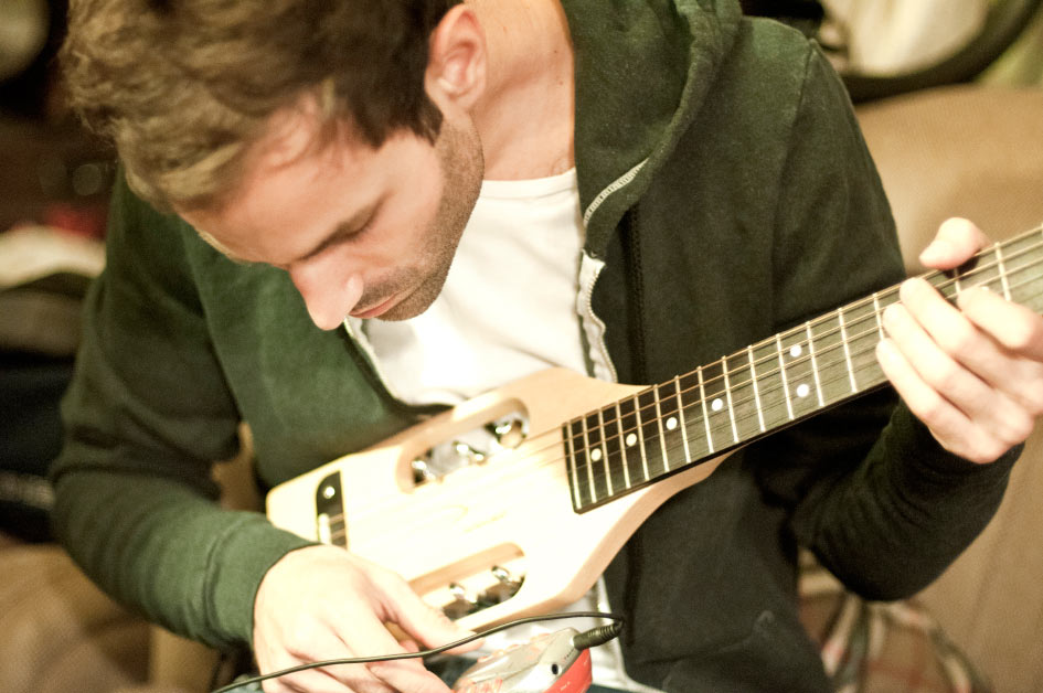 Sean Cimino Playing the mini Guitar Foster the people Guitar player and singer Sean Cimino playing a custom guitar photo by Danny Roberts