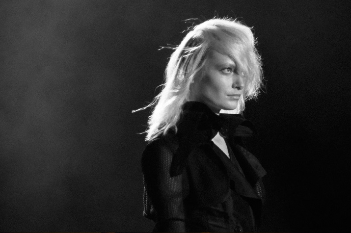 A Degree Fahrenheit Spring 2012 A Black and white photo of a blonde Model walking through fog in a all black dress on the catwalk of A Degree Fahrenheit Spring 2012 Collection in Tokyo Fashion Week