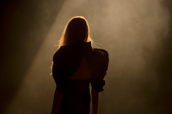 A Backlit Silhouette The Backlit silhouette Model in a black dress with large shoulders in A Degree Fahrenheit Spring 2012 Collection in Tokyo Fashion Week