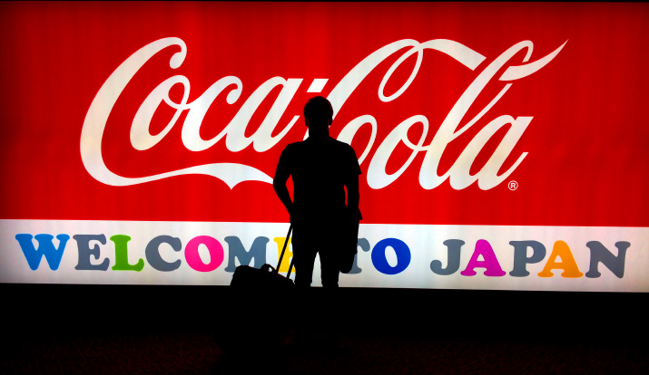 David being Welcomed by Japan & Coca-Cola A iphone photo of david roberts silhouette in Front of the Welcome to Japan Coca-Cola Sign