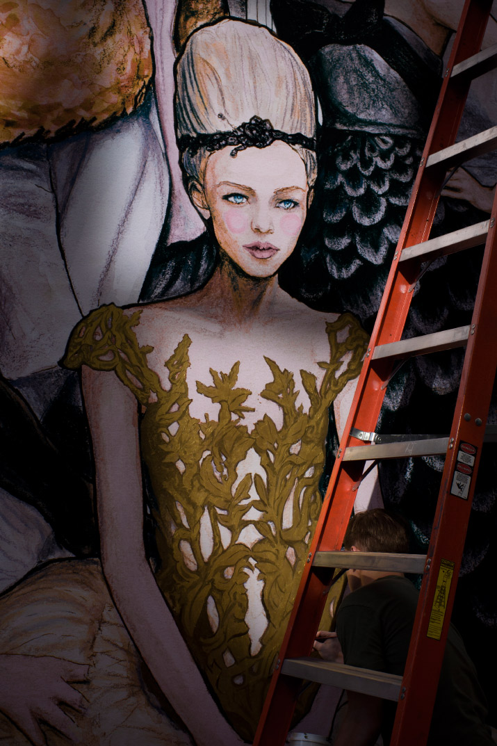 Danny Painting photo by Mandi Roberts Fashion Artist Danny Roberts Painting gold on the dress inspired by Marchesa dress for his mural at new Tiffany and company store on soho new york photo by his sister Mandi Roberts