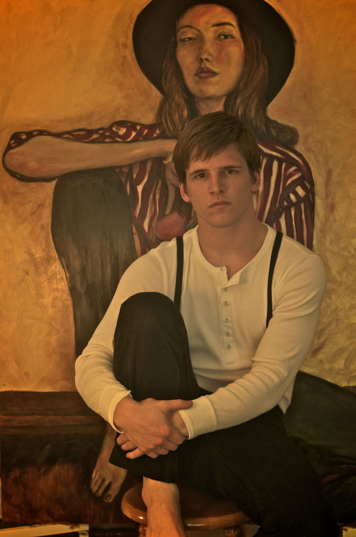 anny Roberts Self Portrait Dress in white and Black in front of his Painting of Sophie Ward looking like an 1920s irish immigrant