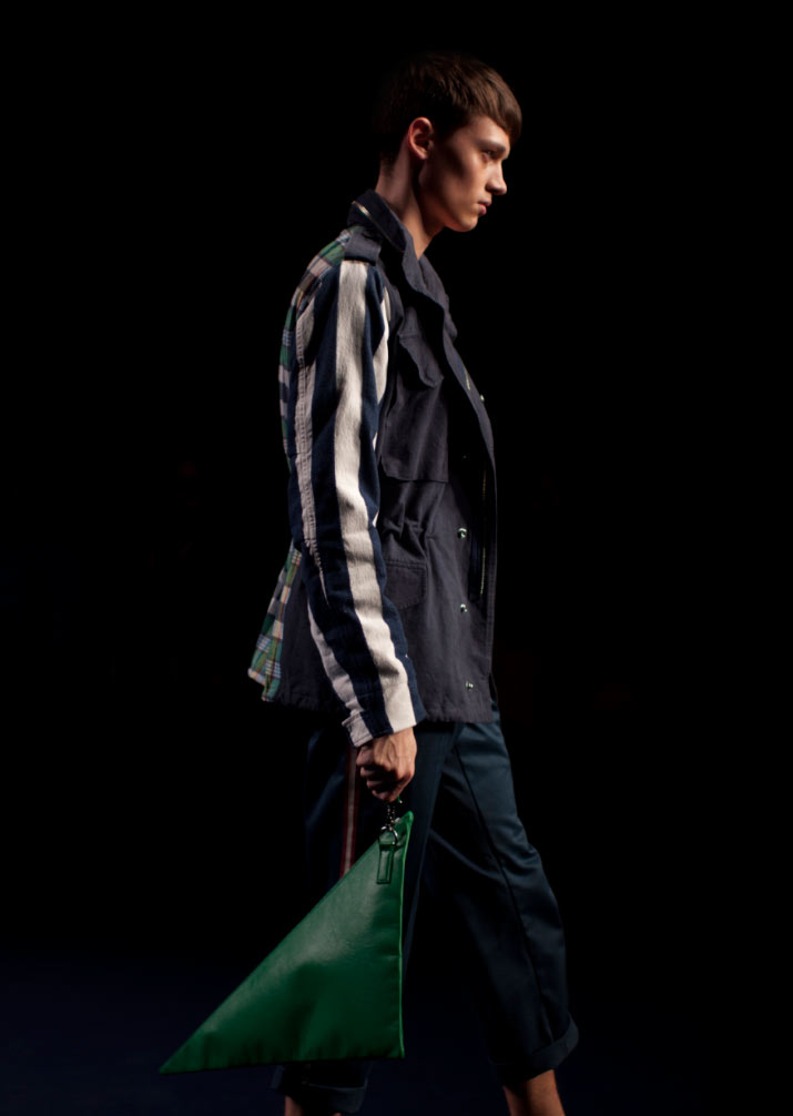 Phenomenon Spring 2012 - Trench Coat a profile of a model wearing a beige and yellow and red Trench Coat in Fashion Designer Phenomenon Spring 2012 Fashion Show Tokyo Fashion Week pictures by fashion photographer Danny Roberts