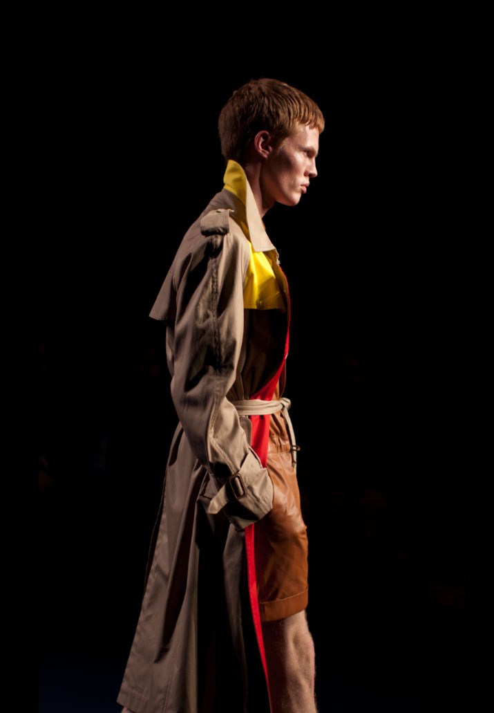 Phenomenon Spring 2012 - Trench Coat fashion photographer Danny Roberts A profile of a male model wearing a blue green and white jacket carrying a green handbag in Fashion Designer Phenomenon Spring 2012 Fashion Show Tokyo Fashion Week pictures