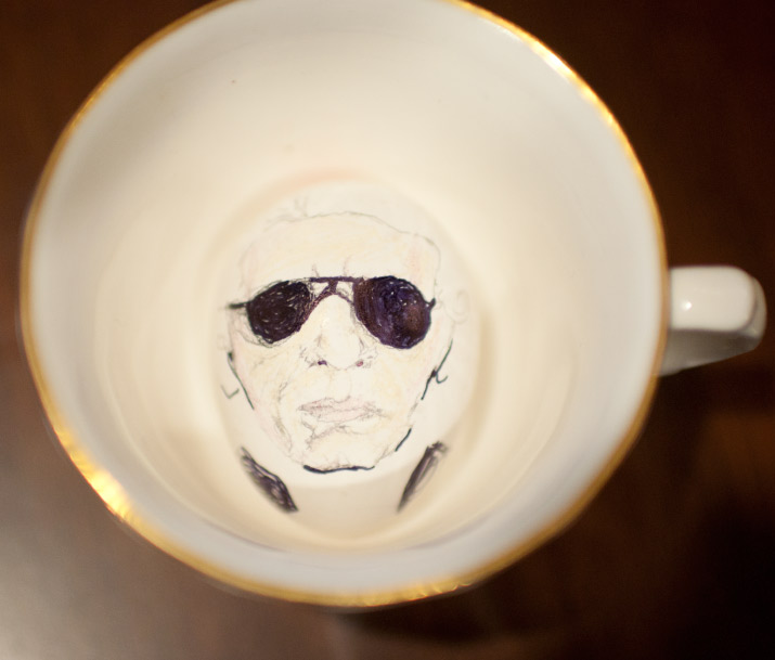 Karl Eggerfeld in a cup A color photo of karl lagerfeld drawn onto a eggs by artist danny roberts sitting in a cup